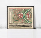 The image is a framed vintage map of a city, depicting a detailed layout of streets, buildings, and other urban features.