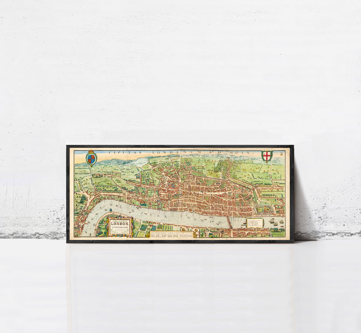 A framed map of London, featuring a detailed illustration of the city's streets, landmarks, and surrounding areas.