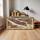 The image is a framed painting depicting a cityscape with a river running through it.