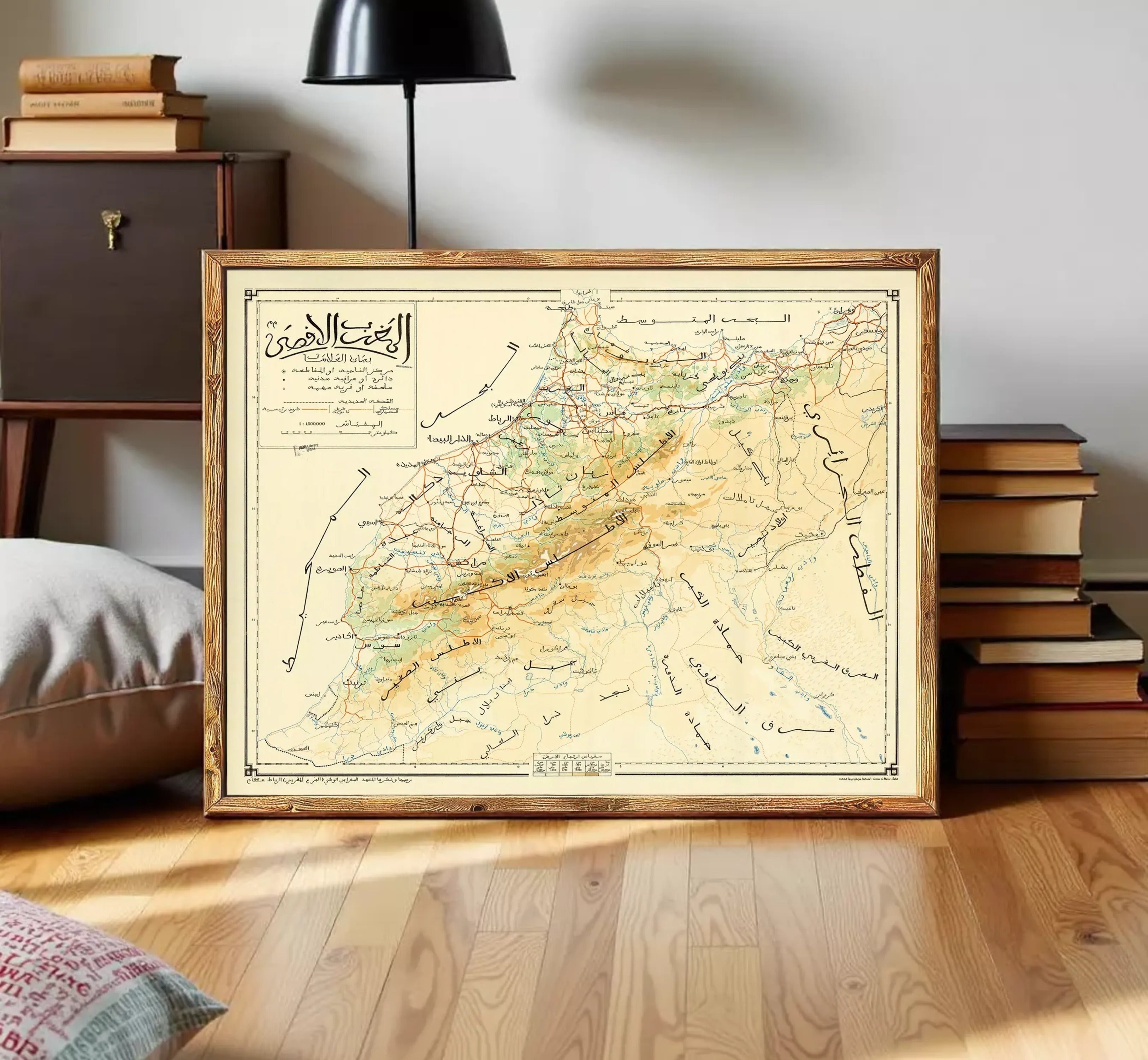 The image is a framed vintage map of a region, likely depicting a mountainous area. The map is framed in a wooden frame and is displayed on a white wall.