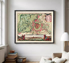 The image is a framed vintage map of a city, depicting a detailed layout of the streets, landmarks, and surrounding areas.