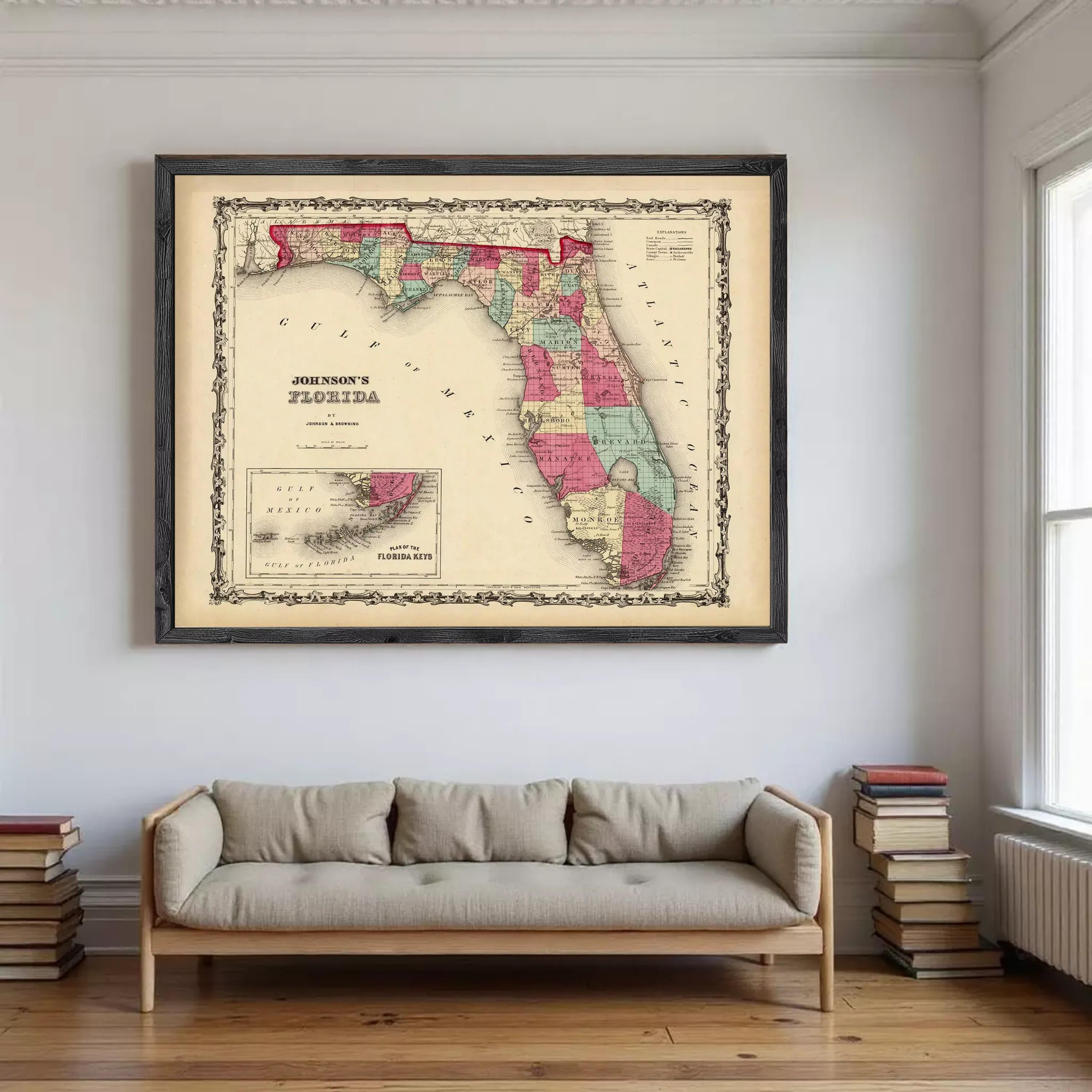 a large framed map of Florida hanging on a wall above a couch in a living room.