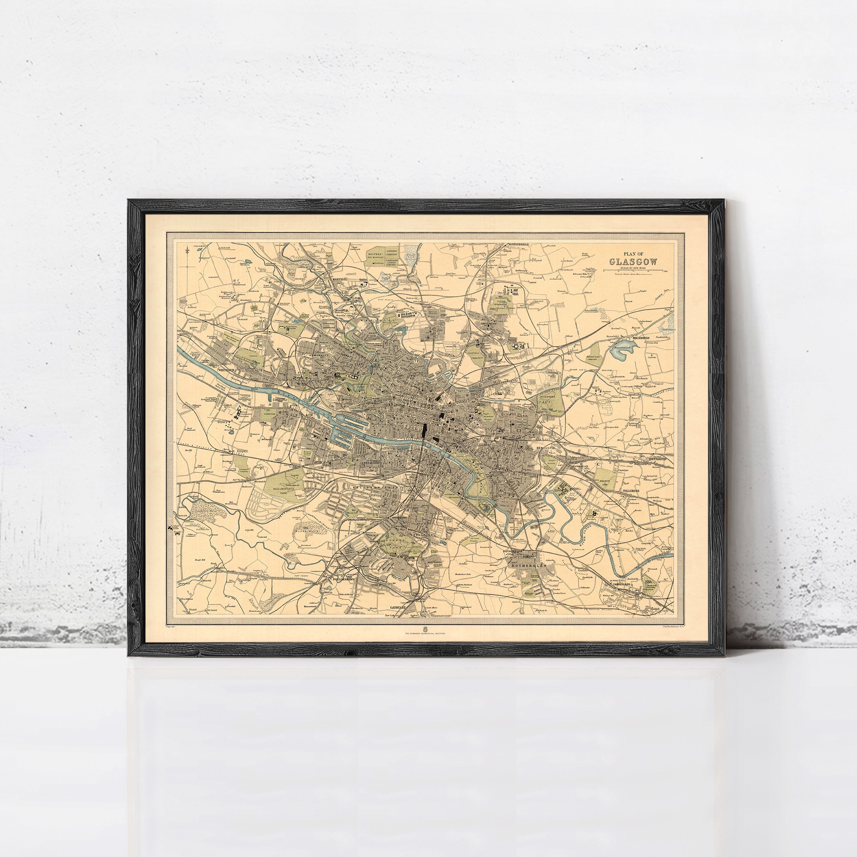 The image is a framed vintage map of Glasgow, Scotland, depicting the city's layout and surrounding areas.