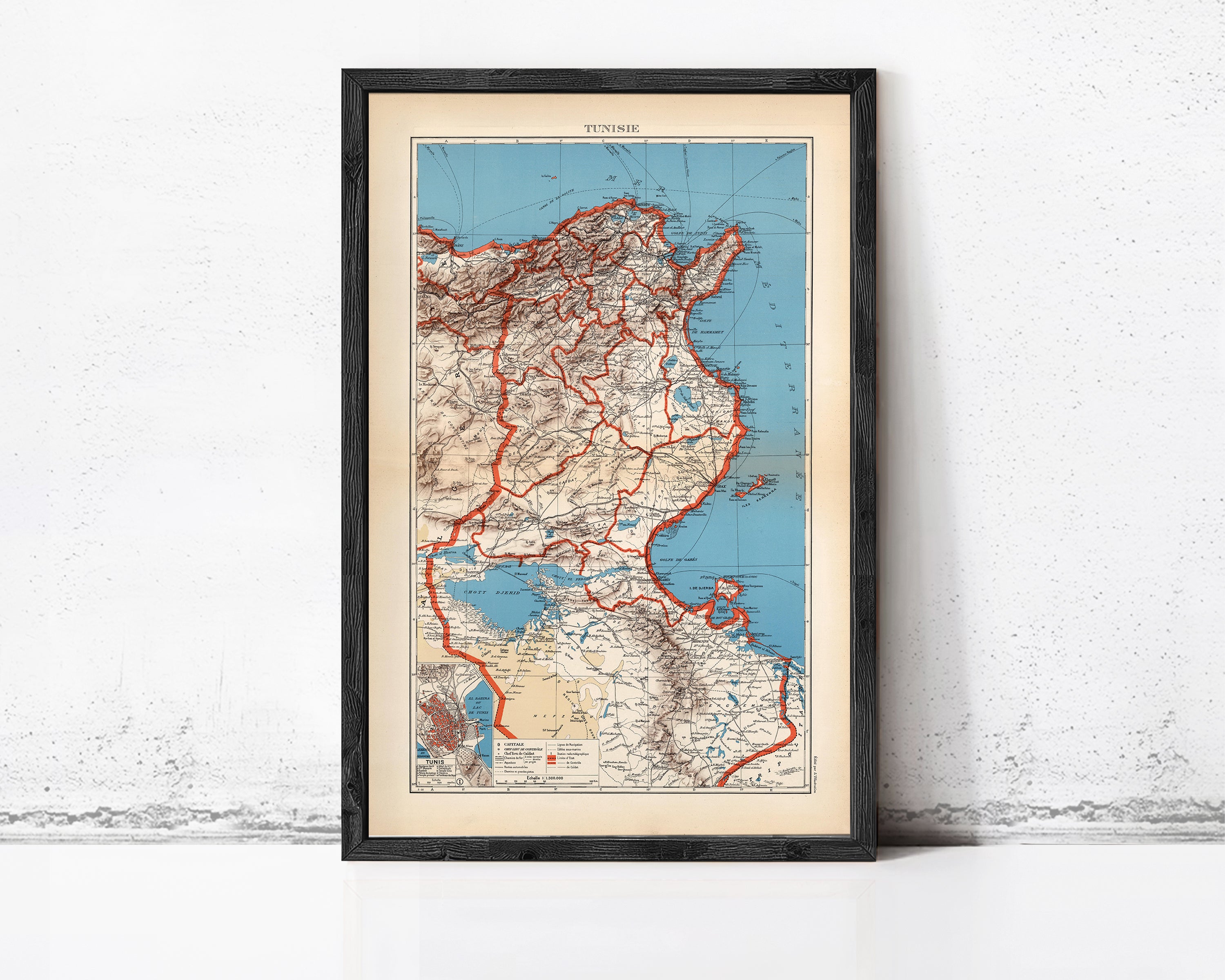 The image is a framed vintage map of the TUNISIAN country, depicting the country's geographical layout and surrounding areas.