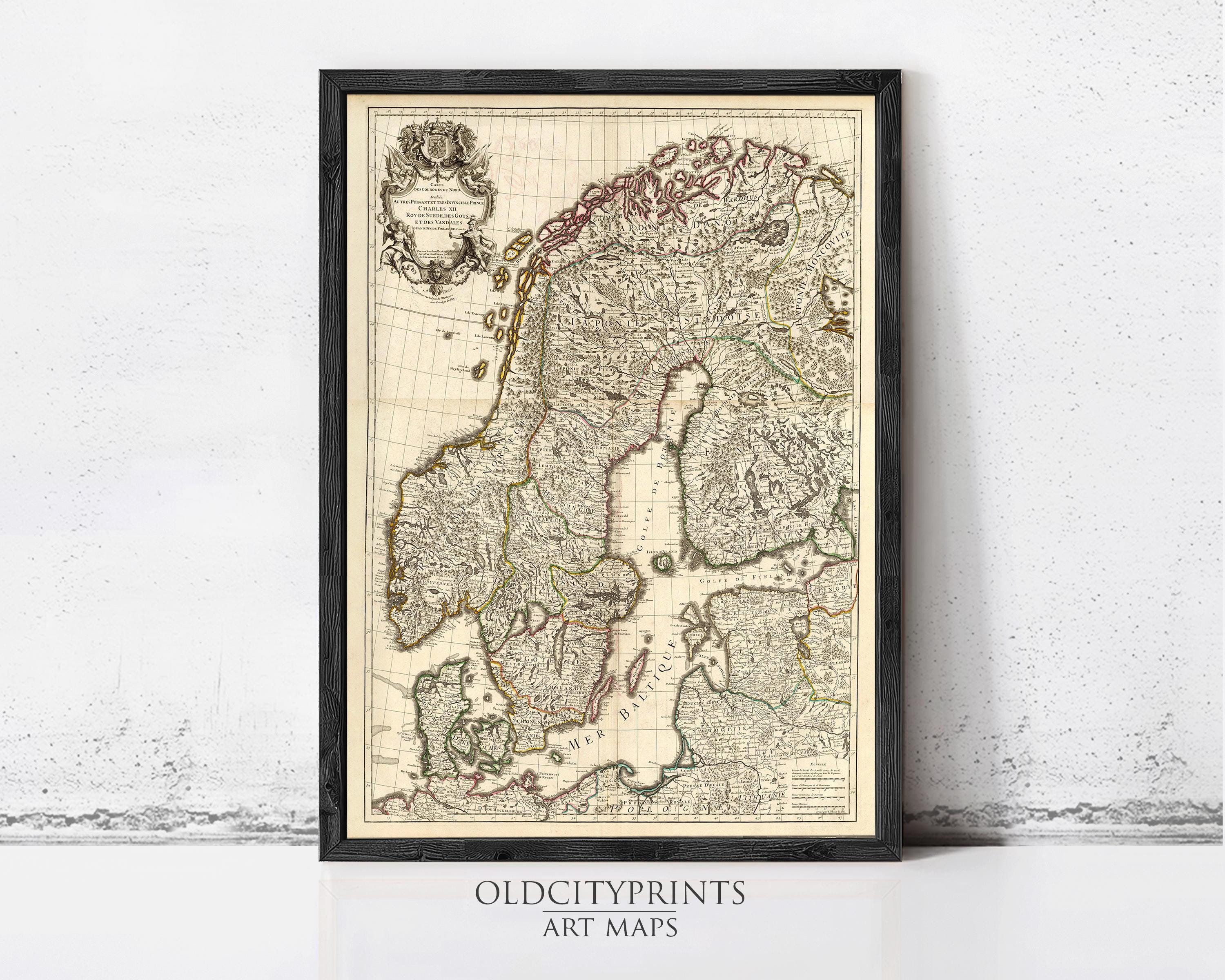 The image is a framed antique map of Europe, likely from the 16th century, displayed on a wall.