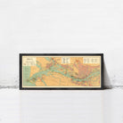A framed map of the island of Riga, showing the geographical layout and surrounding areas.