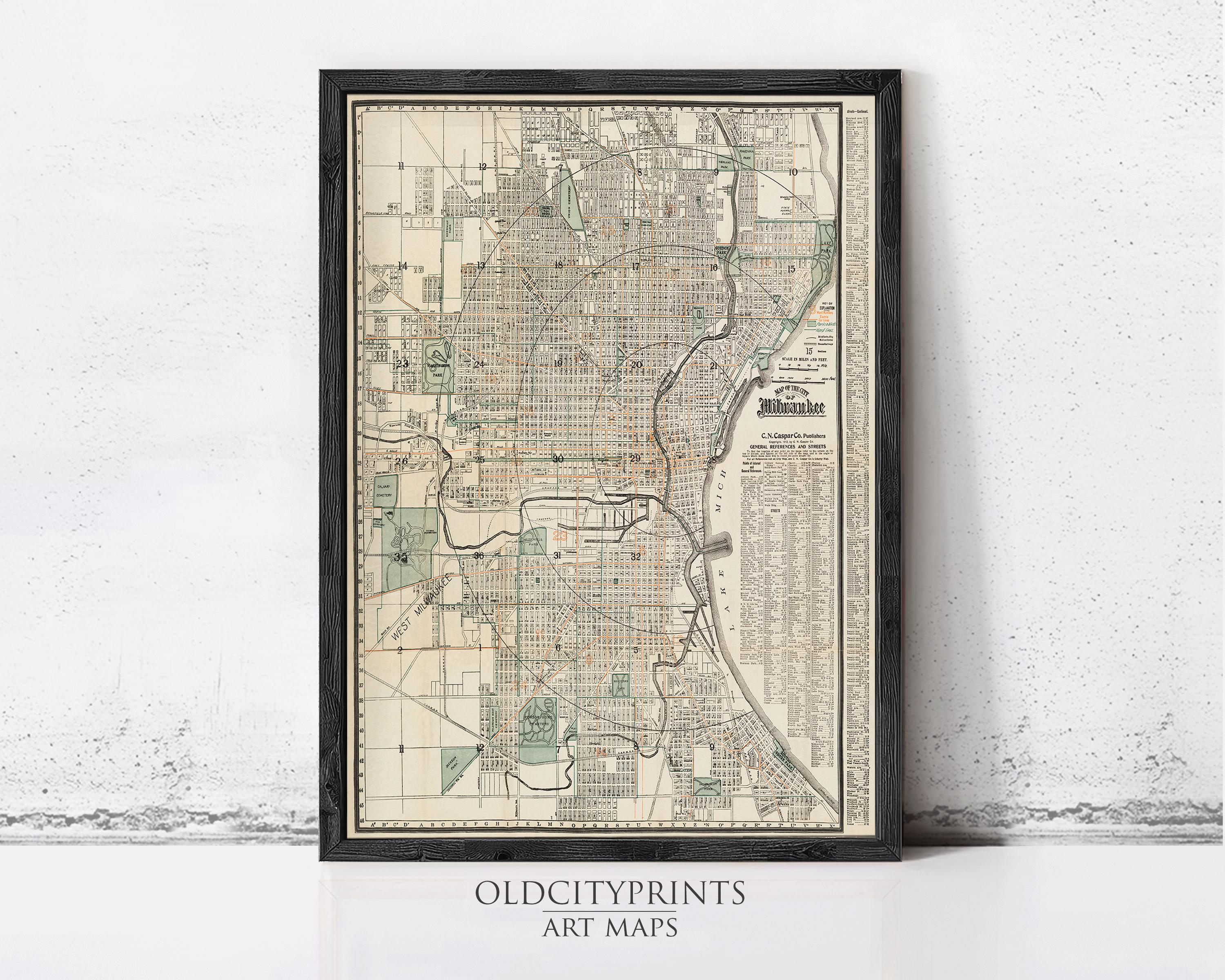 The image is a framed vintage map of a city, likely Chicago, Illinois, with detailed street and park information.