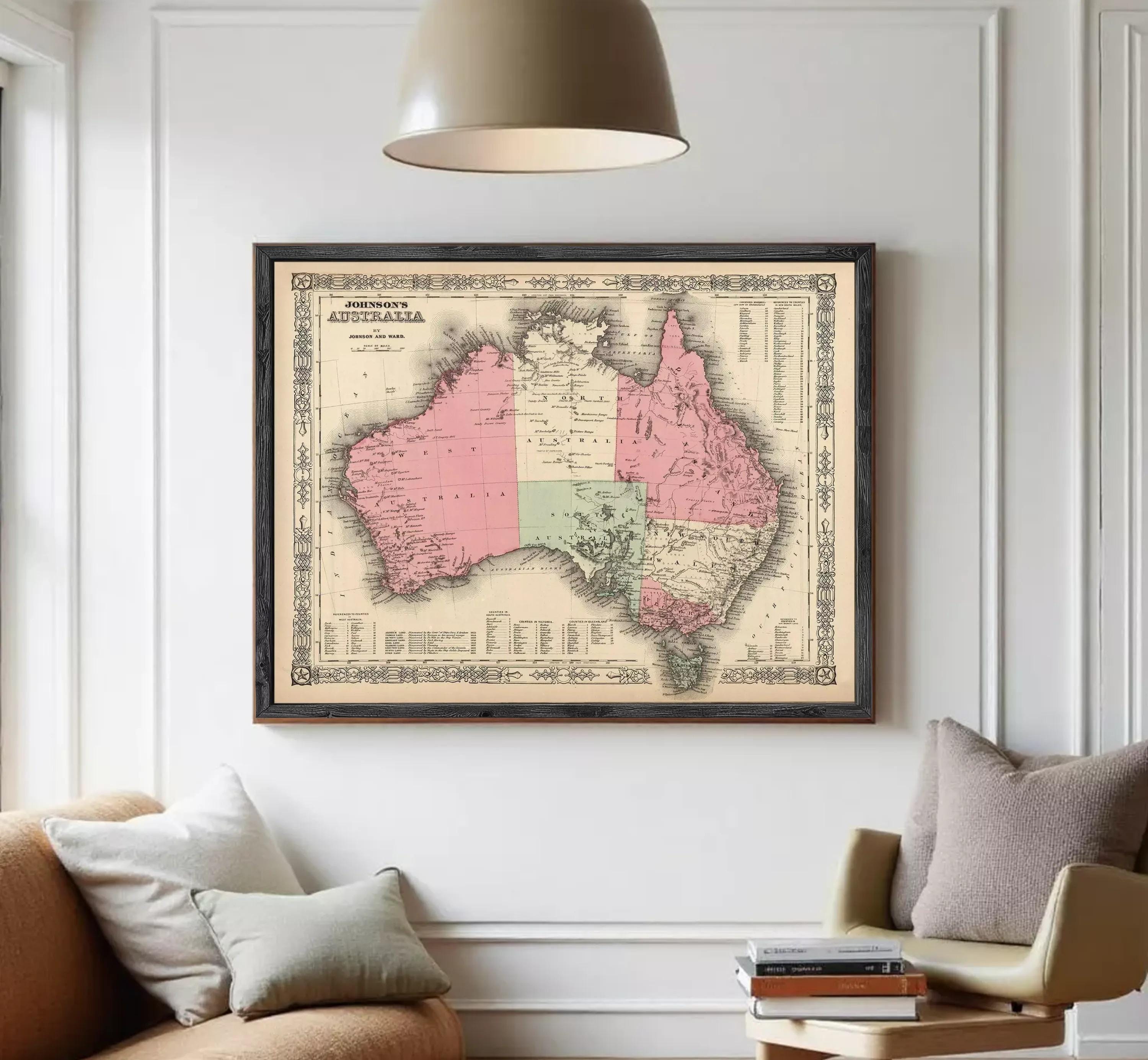 The image is a framed vintage map of Australia, depicting the country in a detailed and intricate manner.