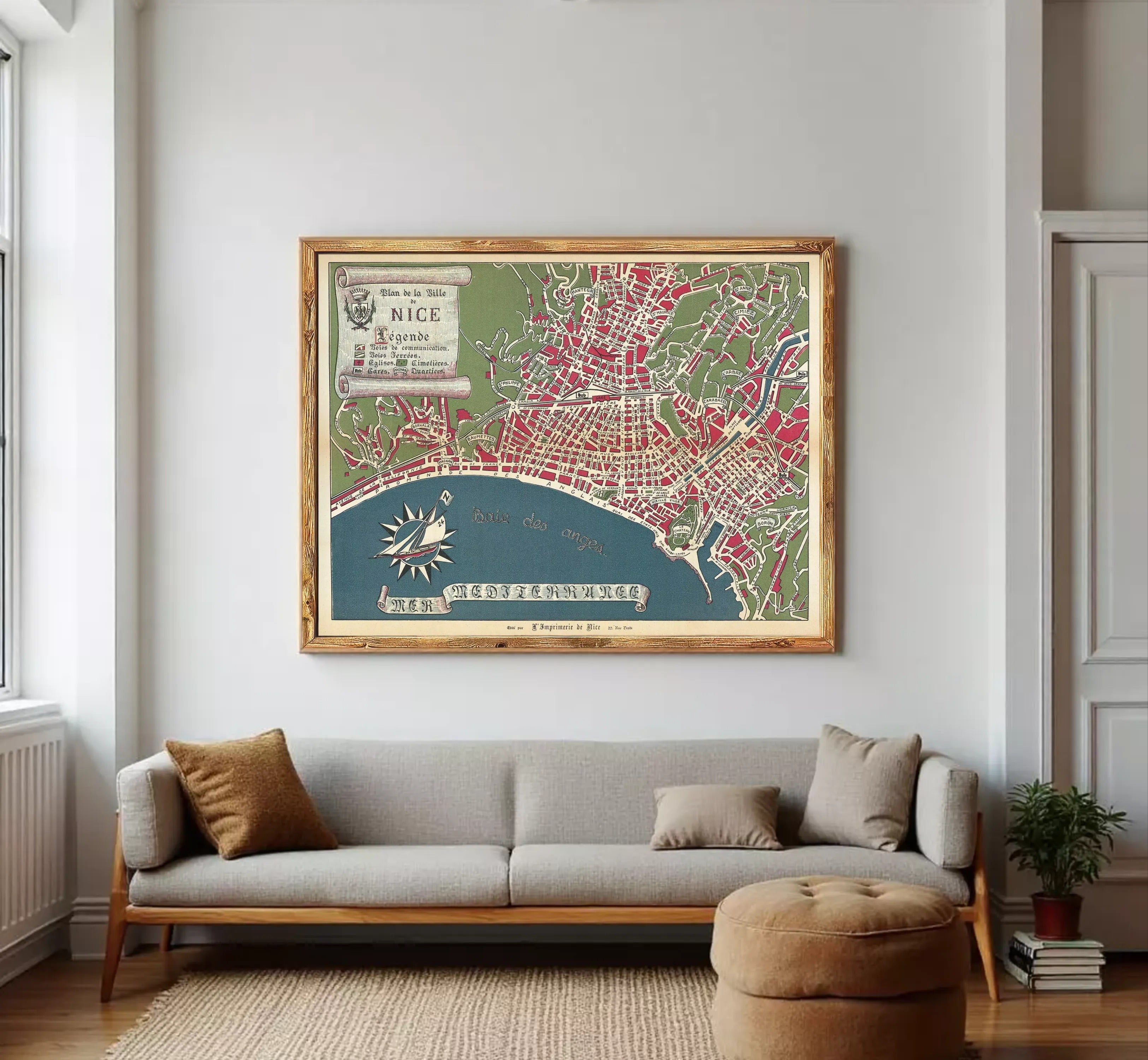 The image is a framed vintage map of Nice, France, depicting the city's layout and surrounding areas.