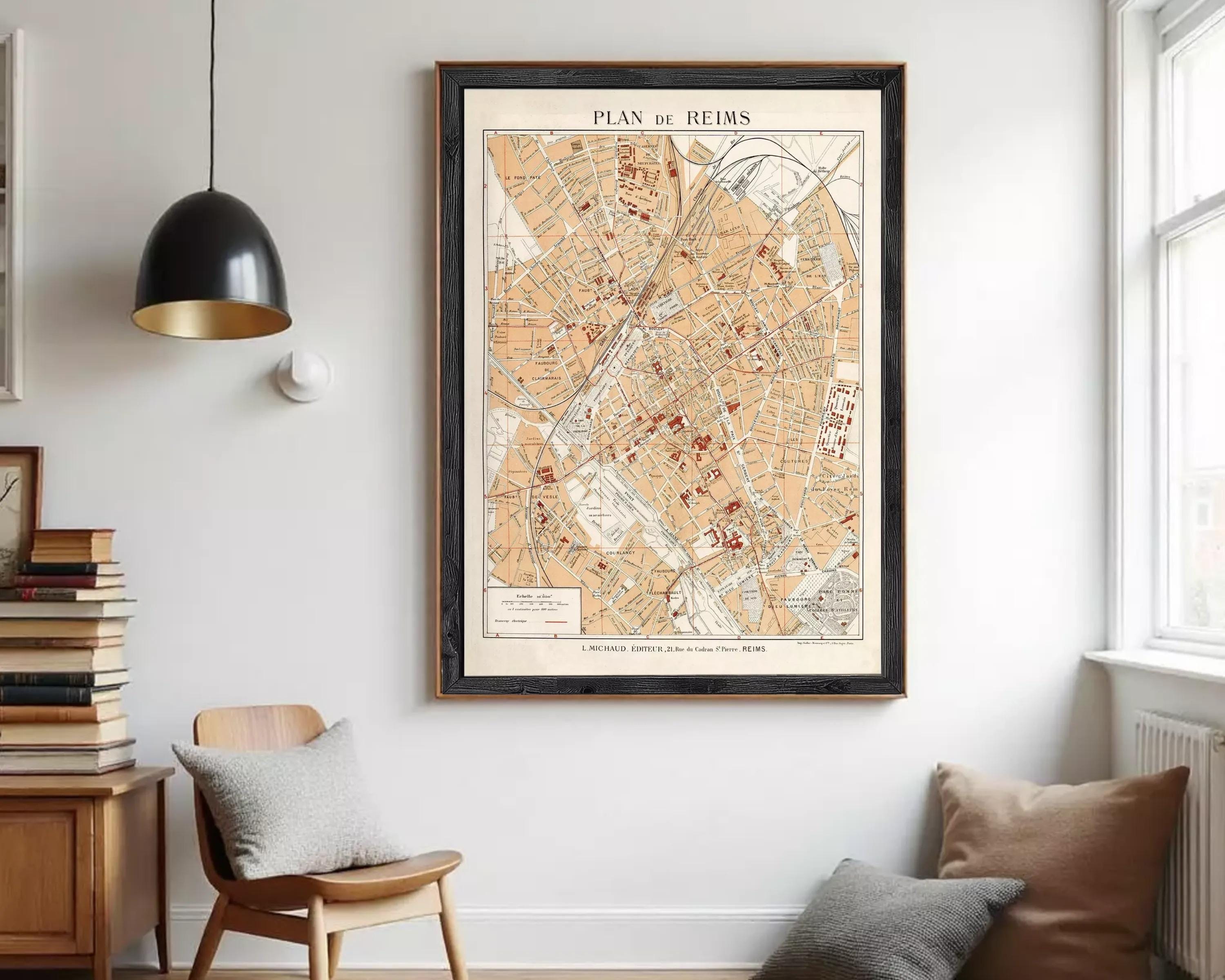 The image is a framed map of Reims, France, depicting the city's streets and landmarks.