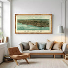 The image is a framed aerial map of a coastal area, depicting a city and its surrounding landscape.