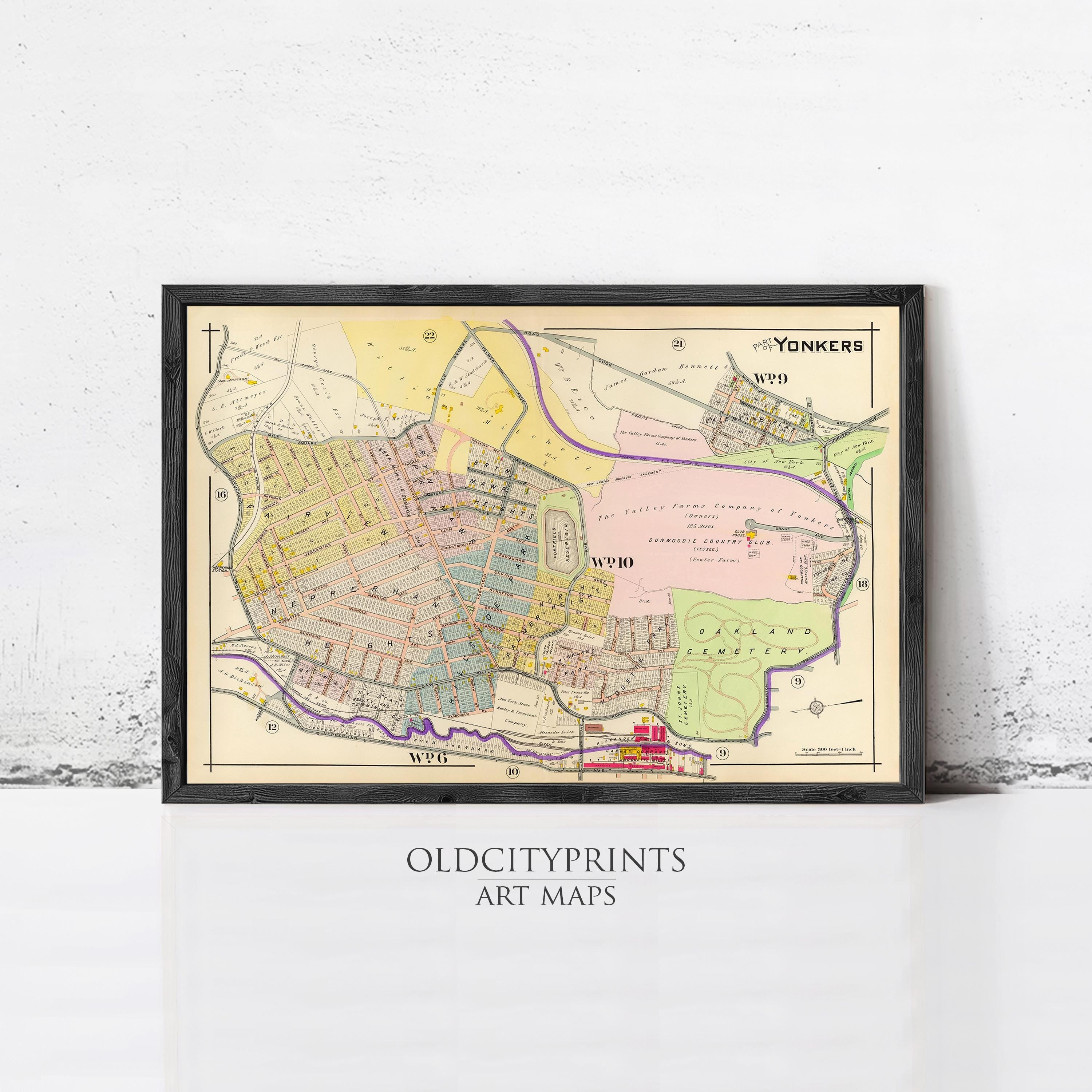 The image is a framed vintage map of a neighborhood, likely from the early 20th century, with various colored areas and streets labeled.