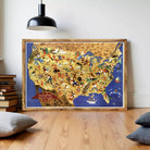 The image is a framed illustration of a colorful map of the United States, depicting various landmarks, people, and animals across the country.