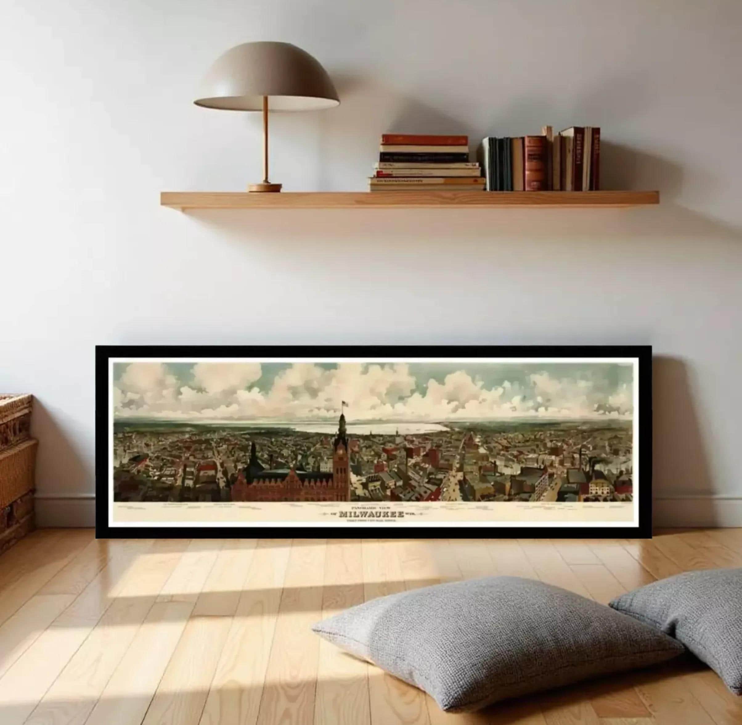 A framed painting of the Milwaukee skyline, featuring a cityscape with various buildings and landmarks.