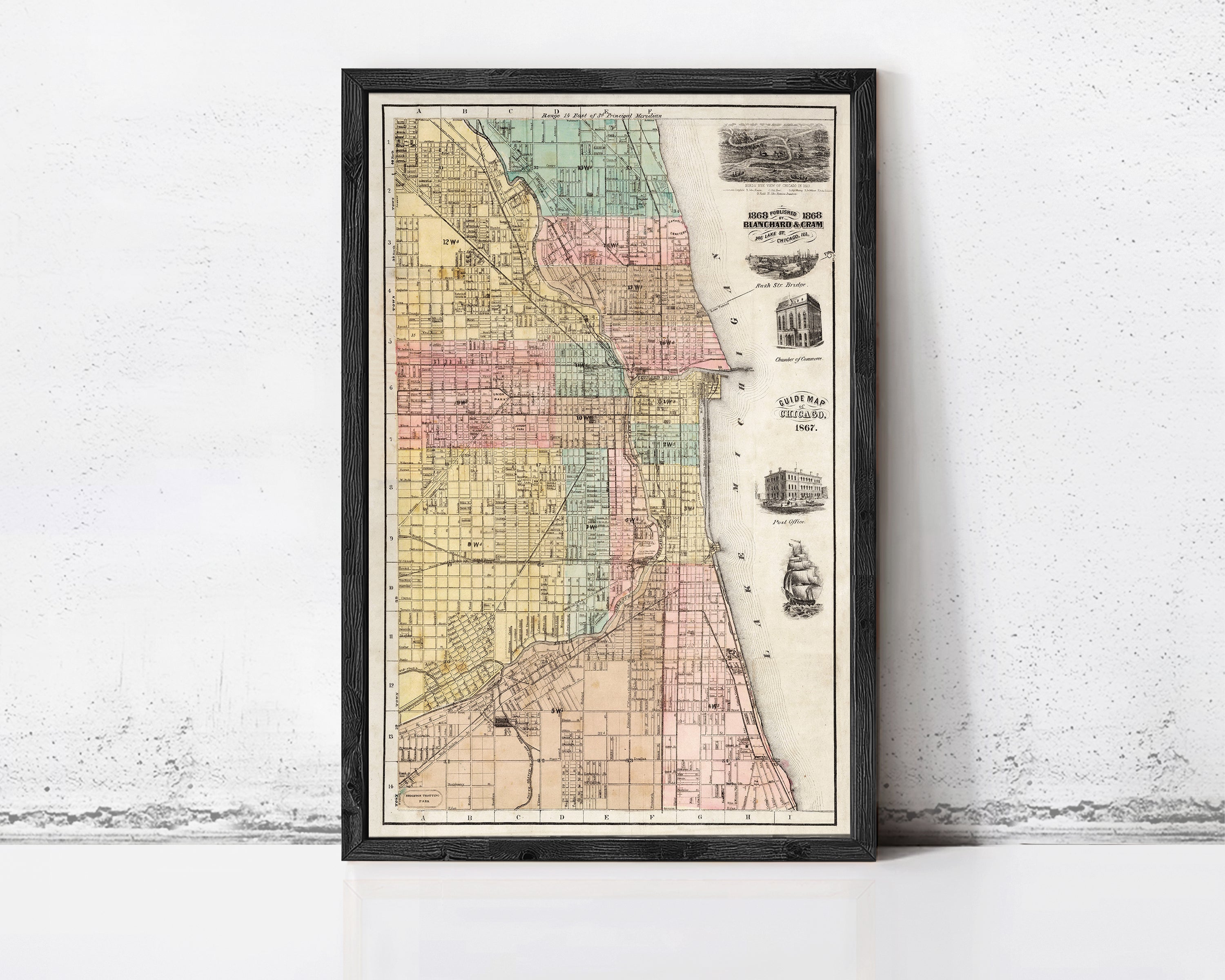 The image is a framed vintage map of Chicago, Illinois, with a black border and a white background.