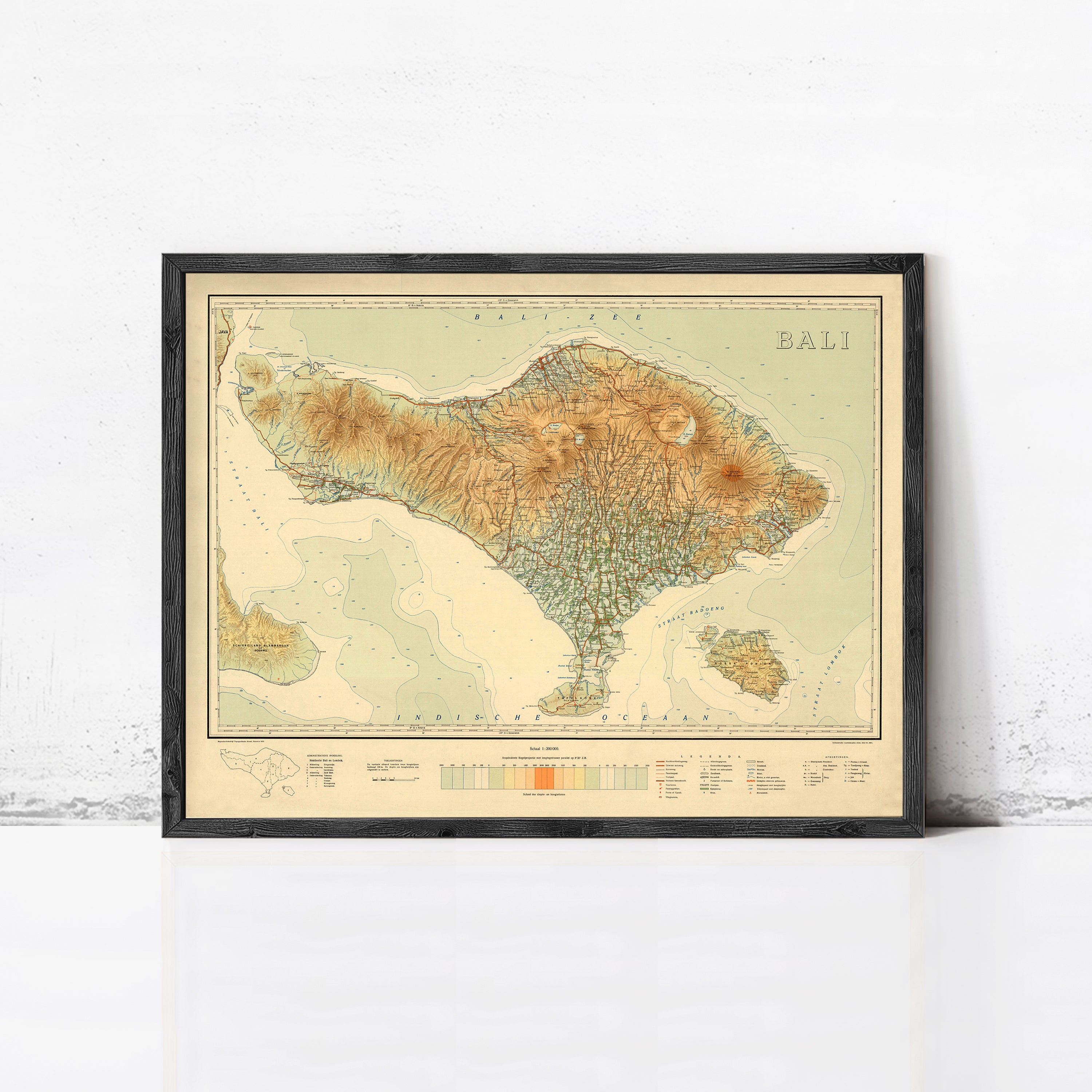 The image is a framed map of Bali, Indonesia, depicting the island's geographical features and boundaries.