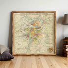 A large framed map of a city or region, with various colored areas representing different zones or neighborhoods.