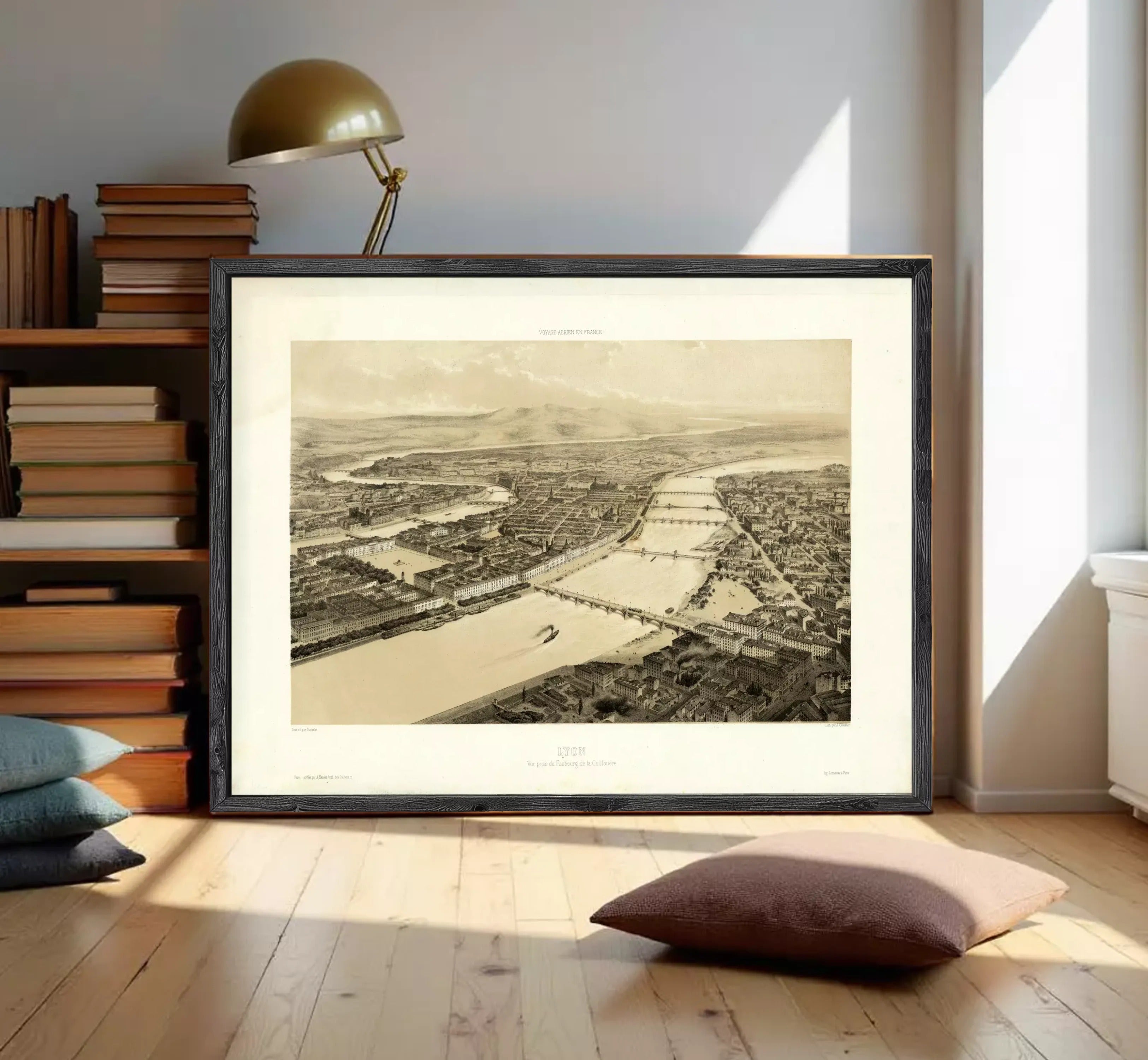 The image is a framed black and white aerial photograph of a cityscape, depicting a river or canal running through the center of the city.