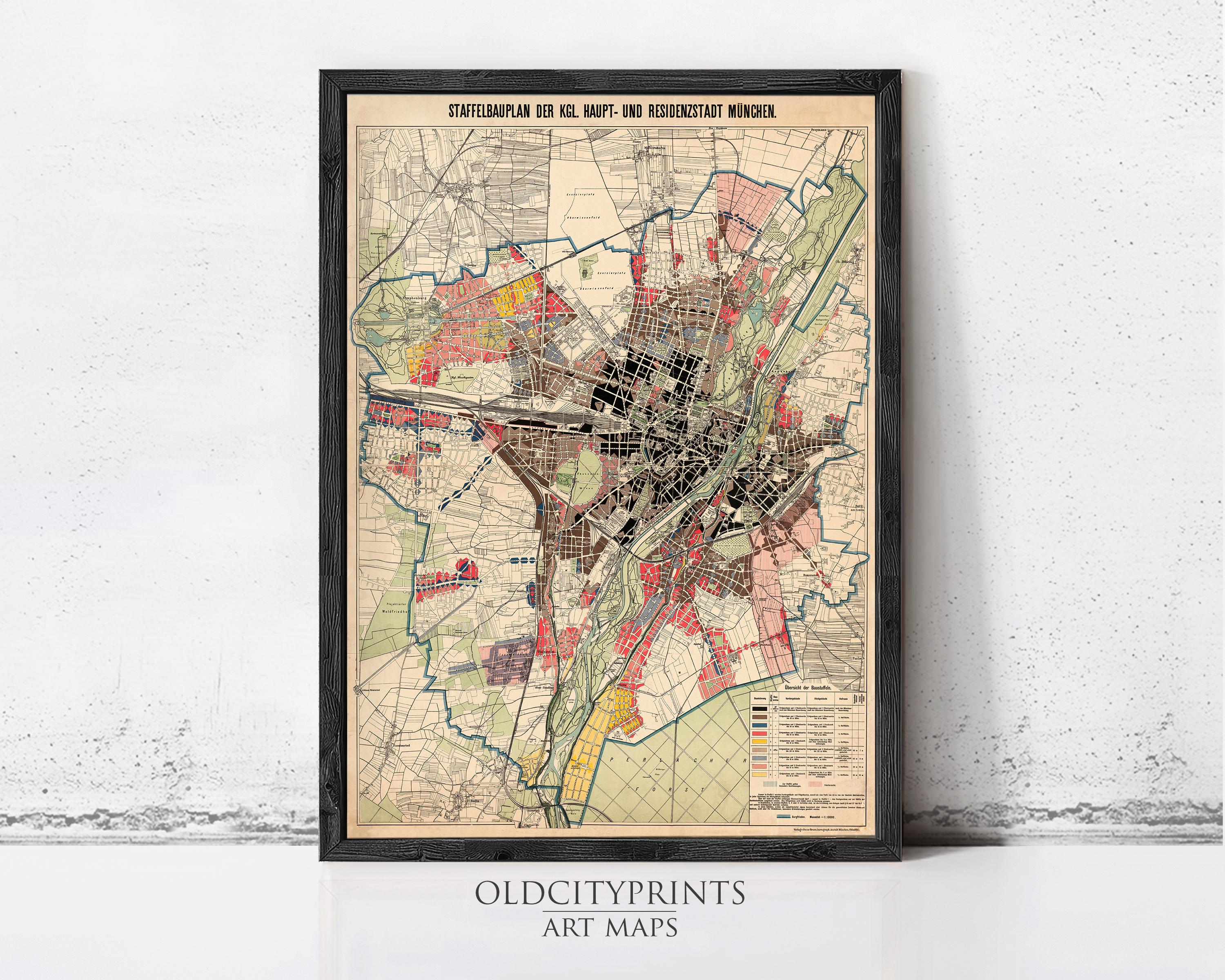 The image is a framed vintage map of a city, likely from the early 20th century, depicting the city's streets, neighborhoods, and other urban features.