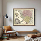 The image is a framed antique map of Europe, featuring detailed illustrations and color-coded regions.