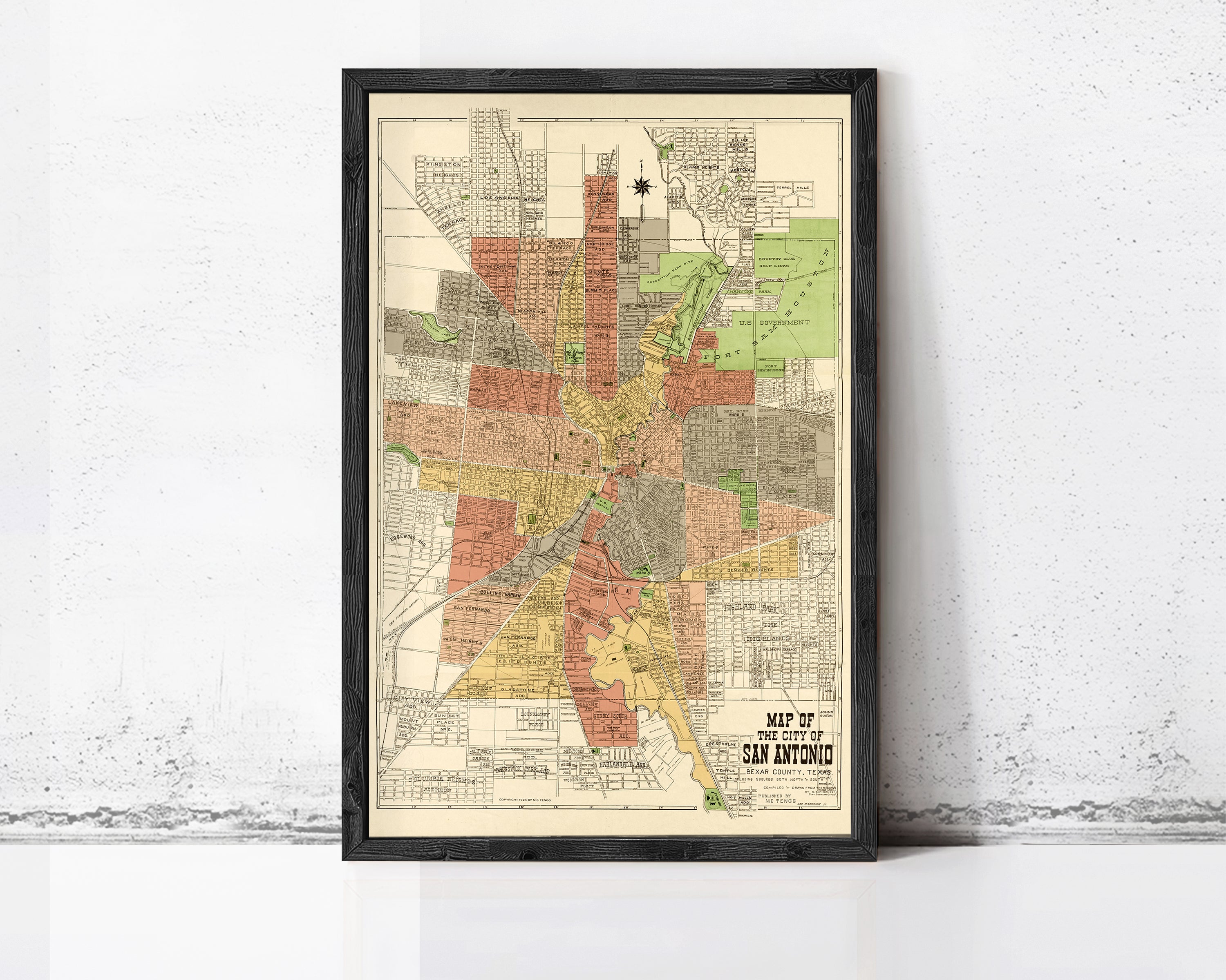 The image is a framed map of San Antonio, Texas, depicting the city's layout and surrounding areas.