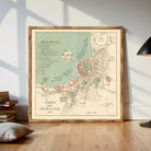 The image is a framed map of a city, likely a historical or vintage map, with various landmarks and streets labeled.