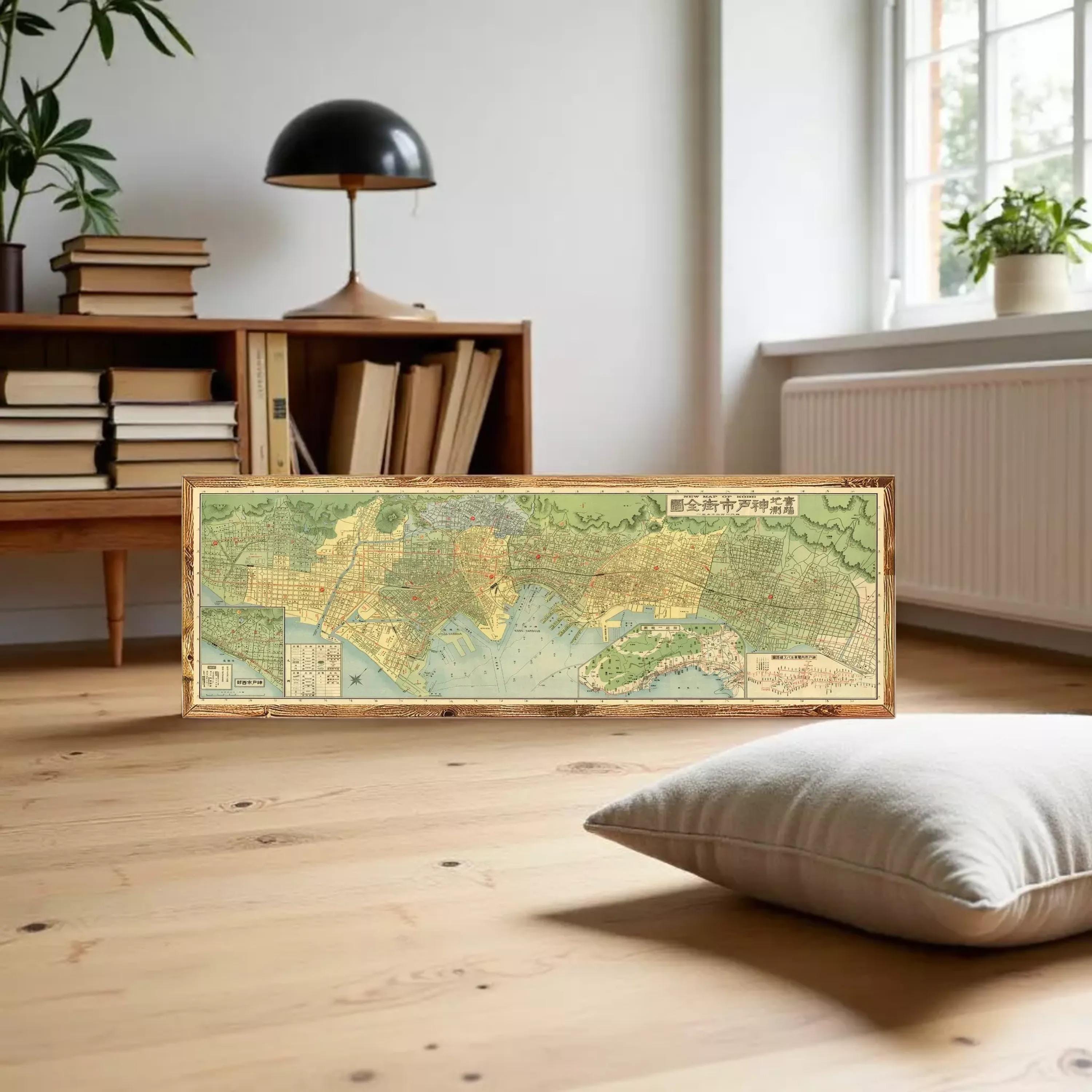 A framed map of a city or region, with a wooden frame and a vintage or antique appearance.