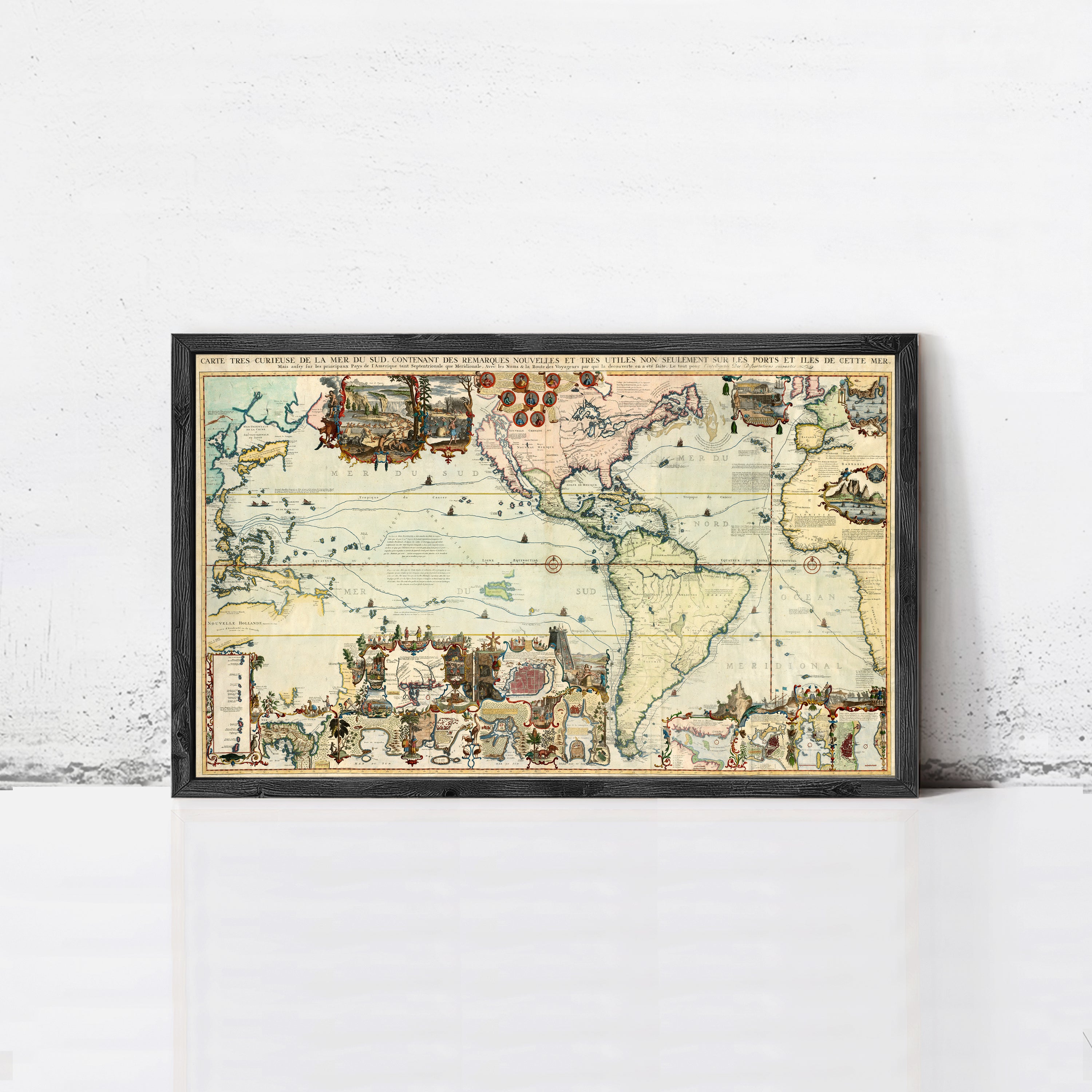 The image is a framed vintage map of the world, depicting various countries and regions with intricate details and illustrations.