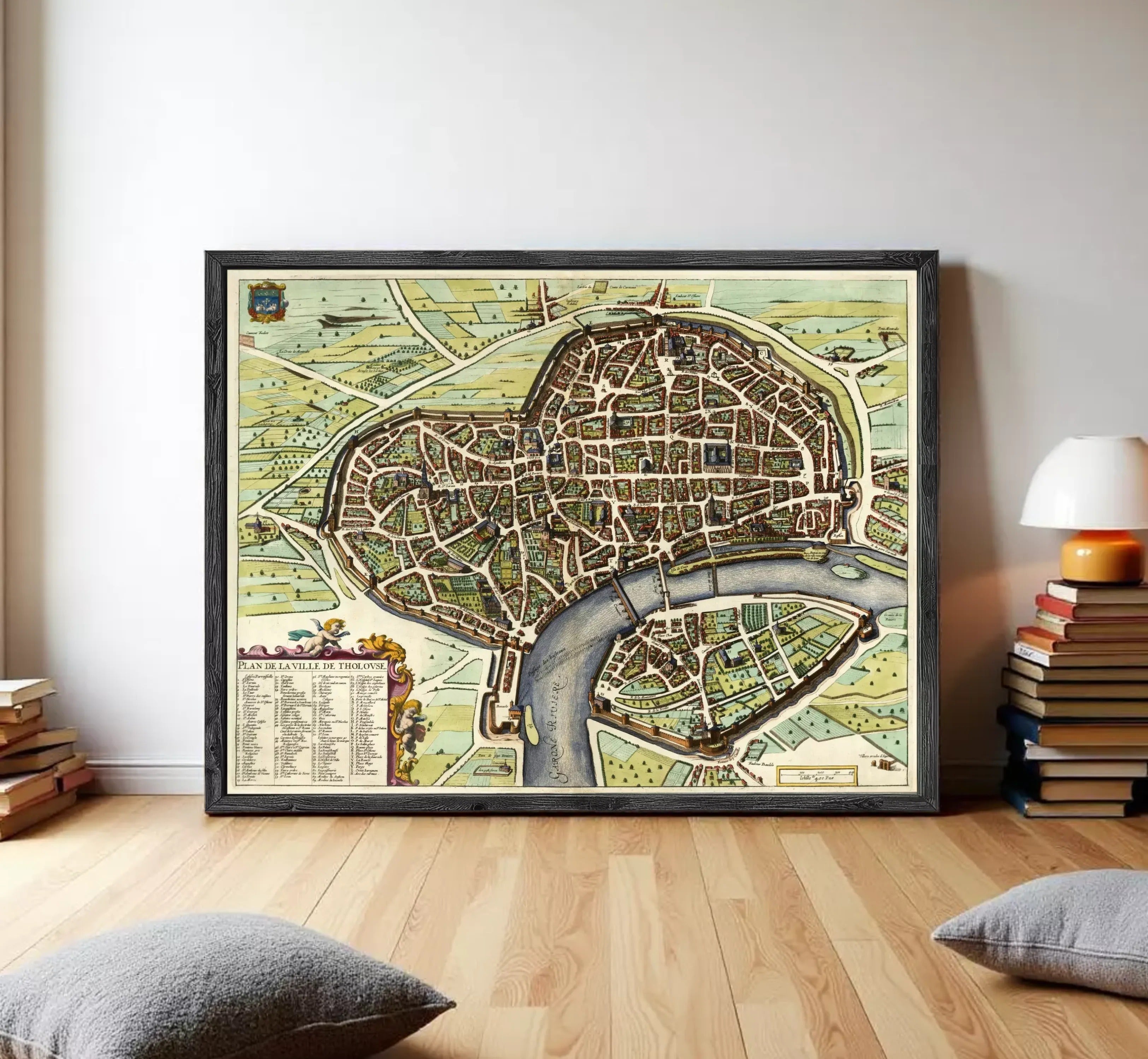 The image is a framed vintage map of a city, depicting a detailed layout of streets, buildings, and other urban features.