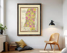 A framed map of the state of Mississippi, with the state's borders clearly marked and the names of the cities and towns within the state.