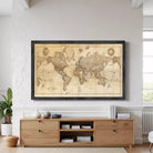 The image is a framed vintage world map with a black border.