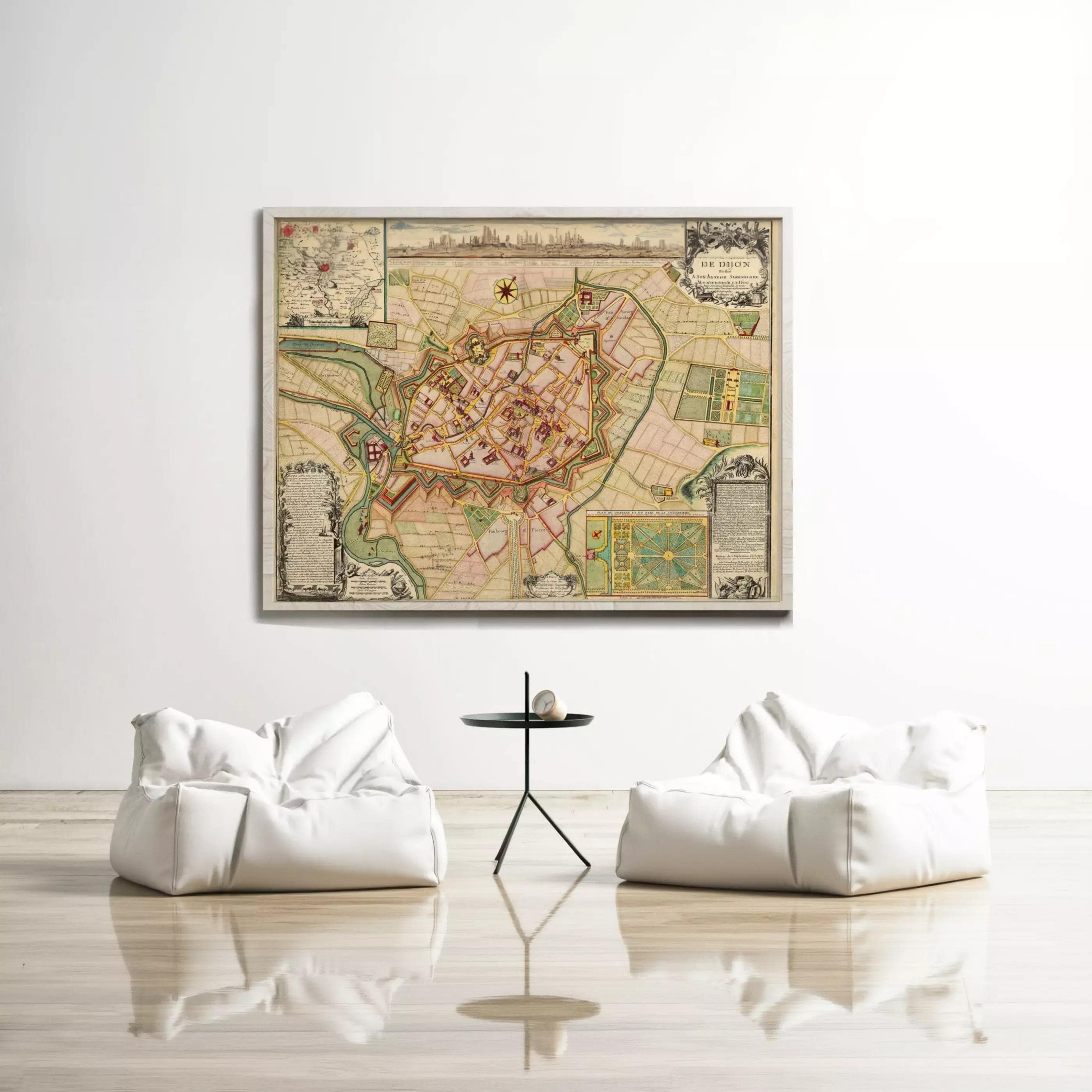 a large, colorful map of a city displayed on a wall, with two white bean bag chairs positioned in front of it.