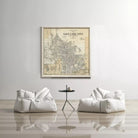 a large framed map of Salt Lake City hanging on a white wall, with two white bean bag chairs positioned in front of it.