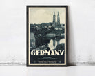 A framed vintage travel poster depicting the city of Silesia, Germany, with the city's iconic landmarks such as St. Peter's Basilica and the Neckar River in the background.