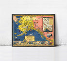 The image is a framed vintage map of Alaska, depicting various landmarks and locations across the state.