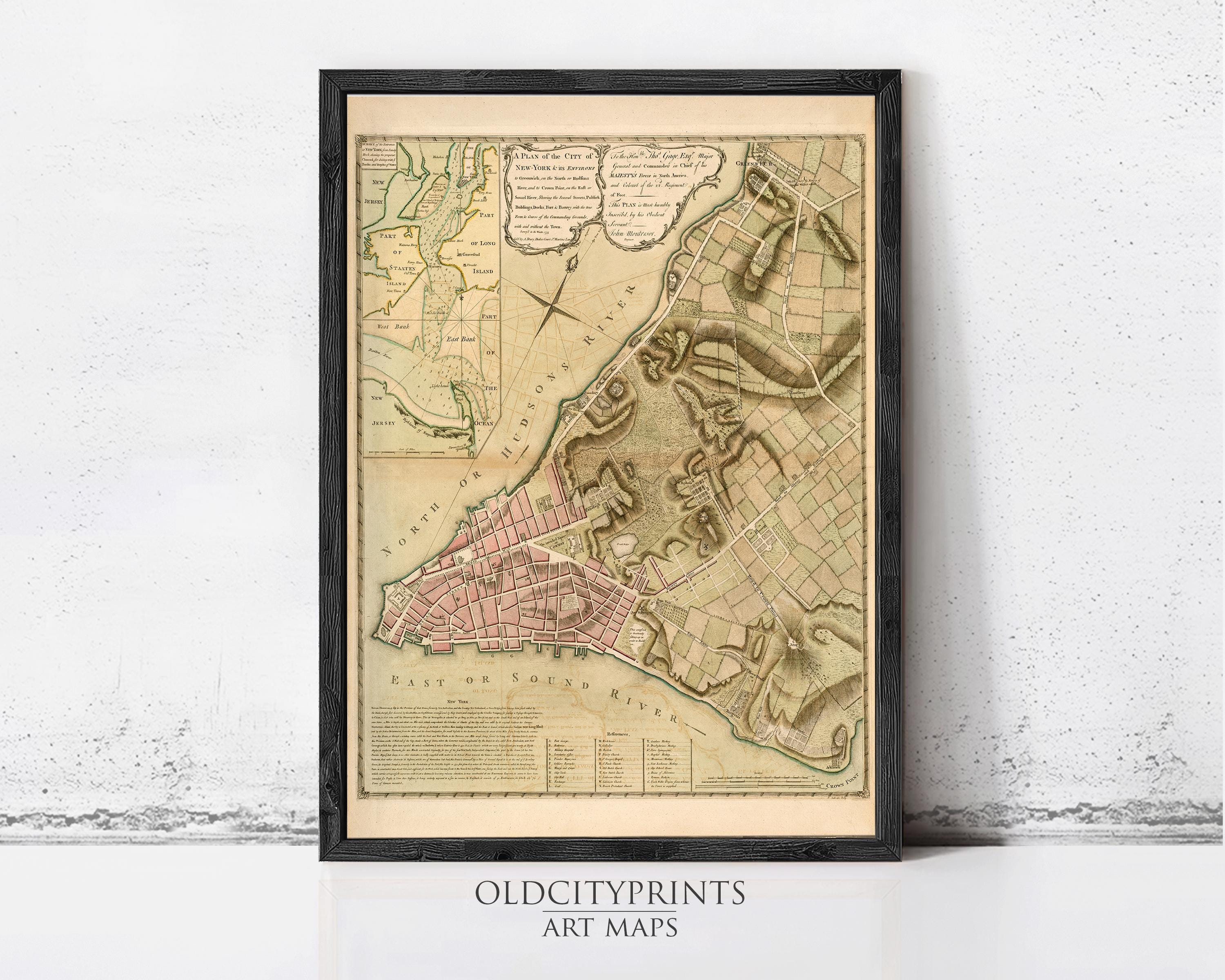 The image is a framed antique map of a city, likely from the 18th century, with detailed cartography and geographical information.