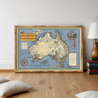 The image is a framed vintage map of Australia, depicting the country's geographical features and landmarks.