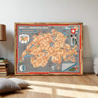 The image is a framed map of Switzerland, featuring various landmarks and locations throughout the country.