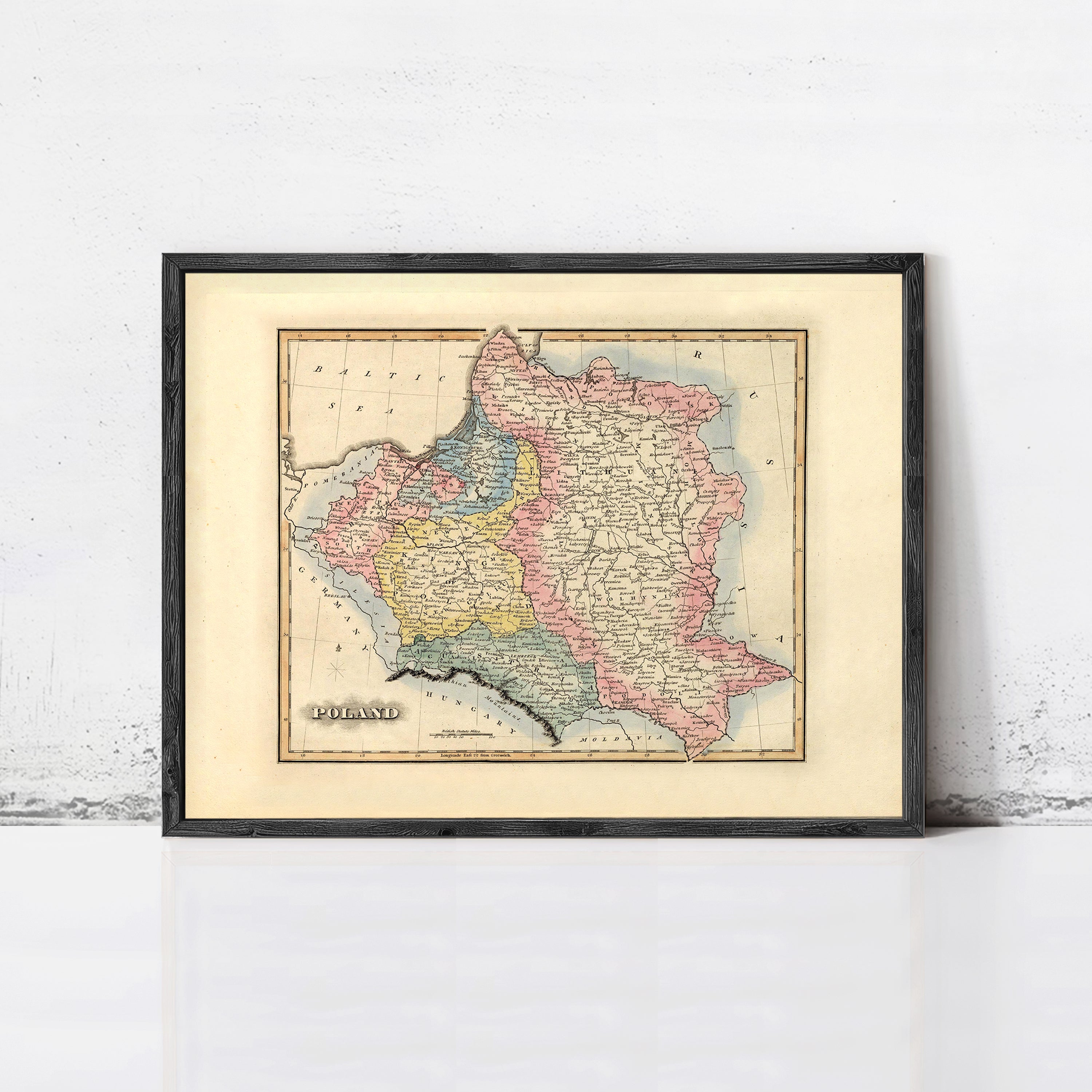 The image is a framed vintage map of Poland, depicting the country in a detailed and colorful manner.