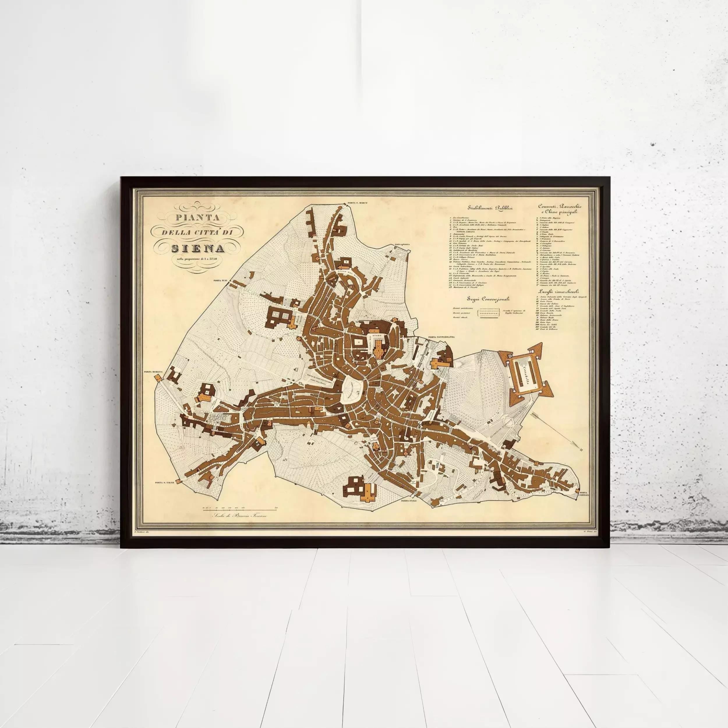 The image is a framed map of the city of Siena, Italy, depicting the layout and streets of the city.