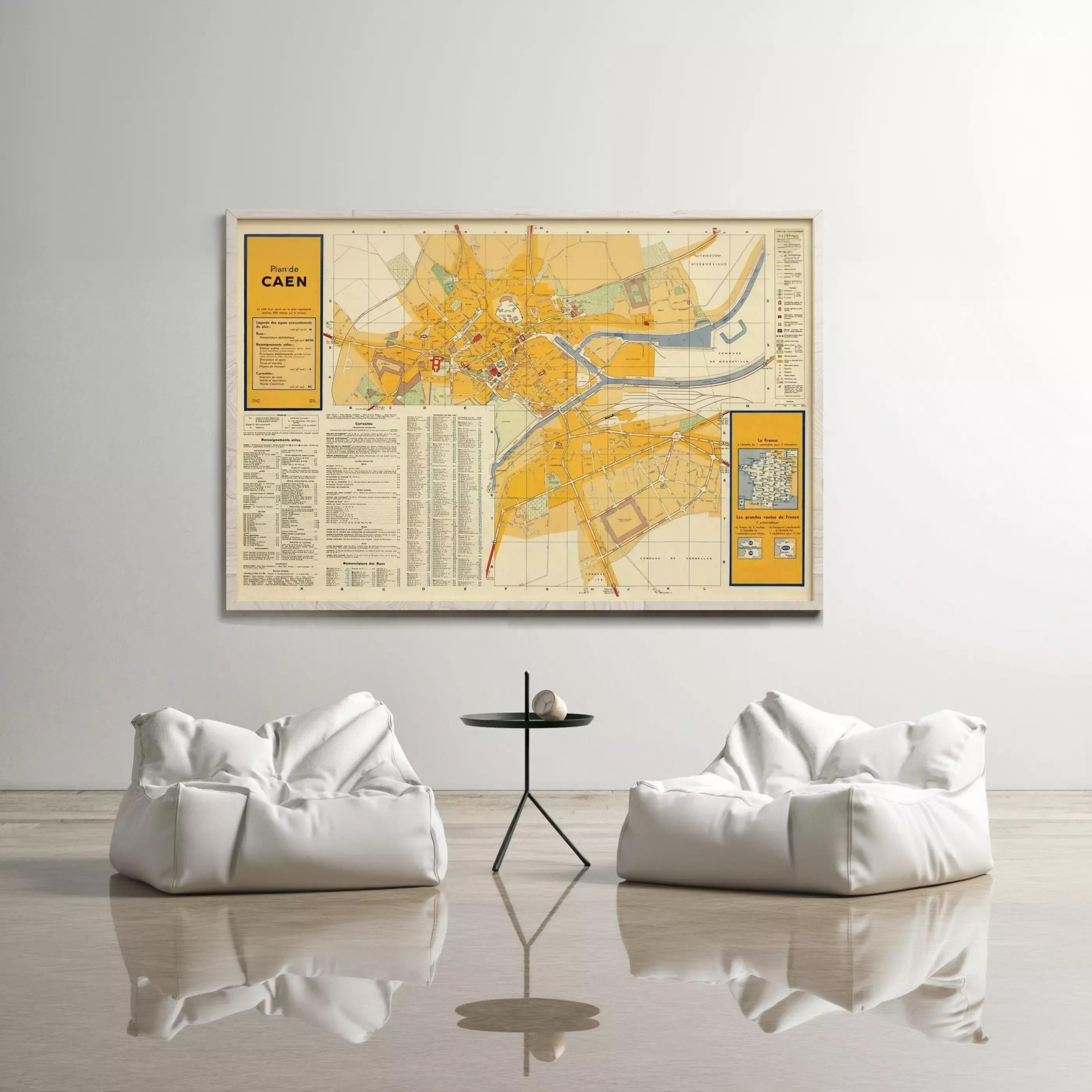 a large map of Prague, Czech Republic, hanging on a wall above two white bean bag chairs and a small black table.