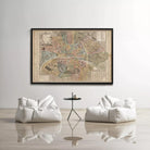 a large framed map of Paris, with two white bean bag chairs positioned in front of it, creating a cozy and inviting atmosphere.