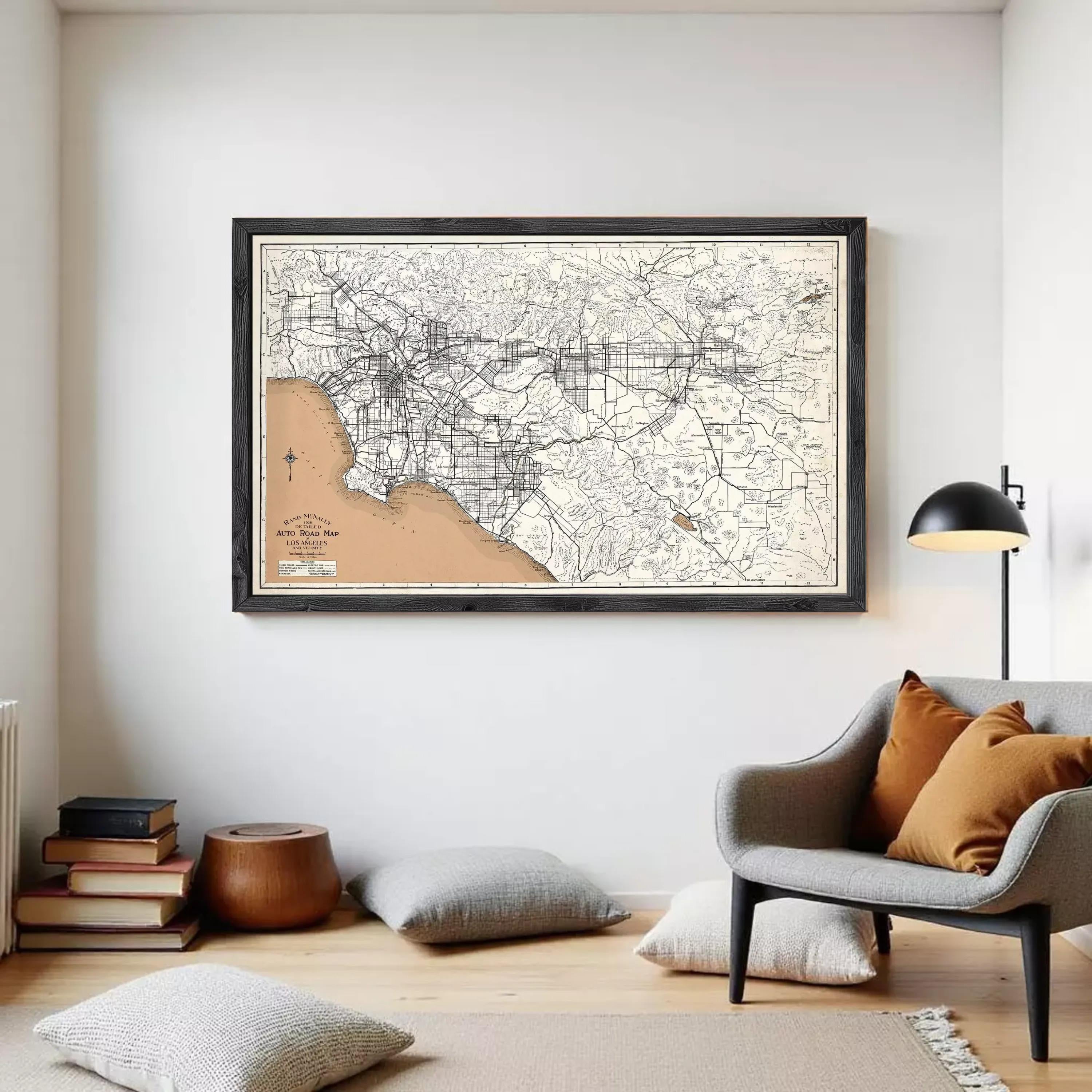 The image is a framed vintage map of Los Angeles, California, with a black border and a beige background.