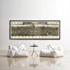 a large framed map of London hanging on a white wall, with two white bean bag chairs positioned in front of it.