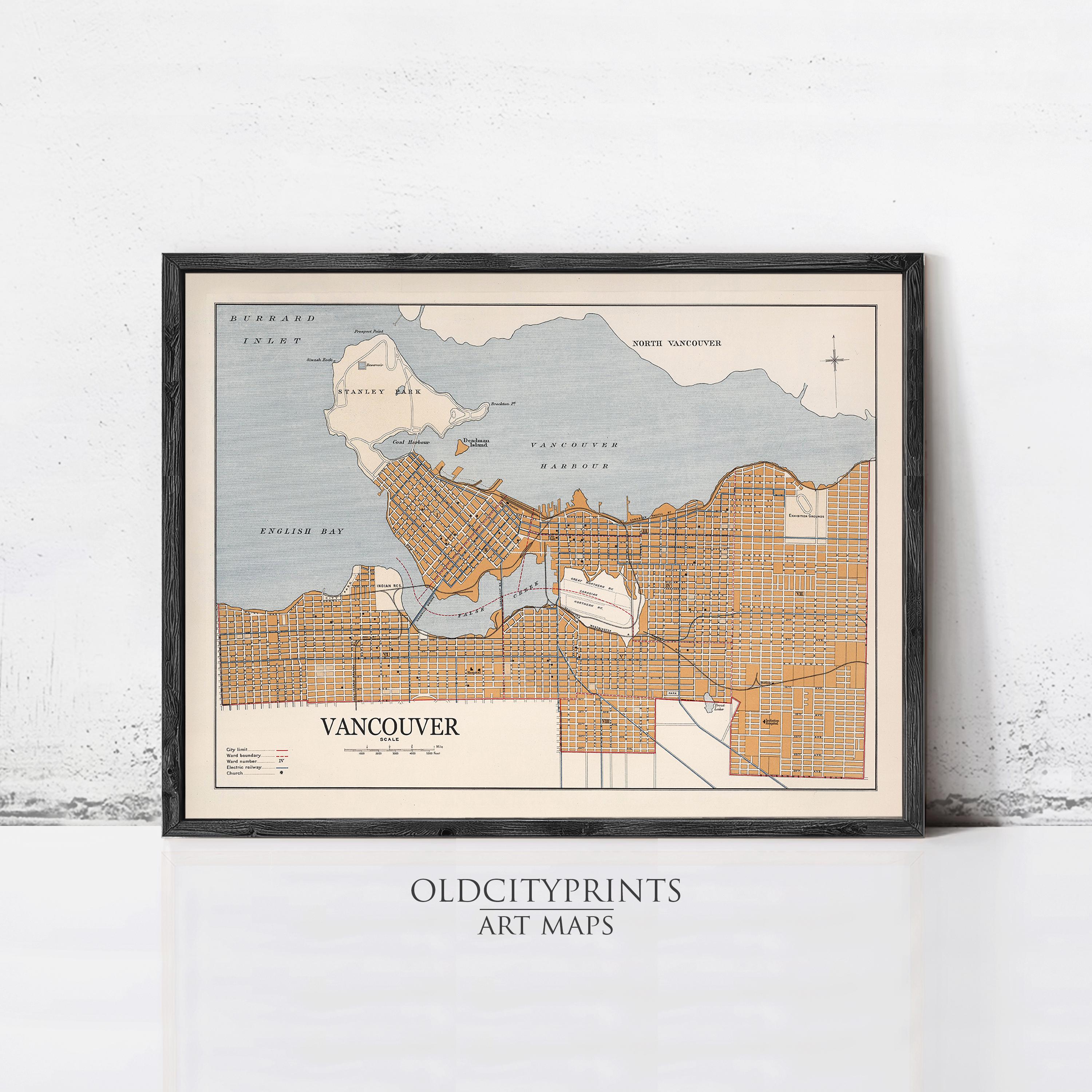 The image is a framed vintage map of Vancouver, Canada, depicting the city's streets and surrounding areas.
