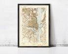 The image is a framed vintage map of the Washington, D.C. area, depicting the city's streets, waterways, and surrounding landscape.