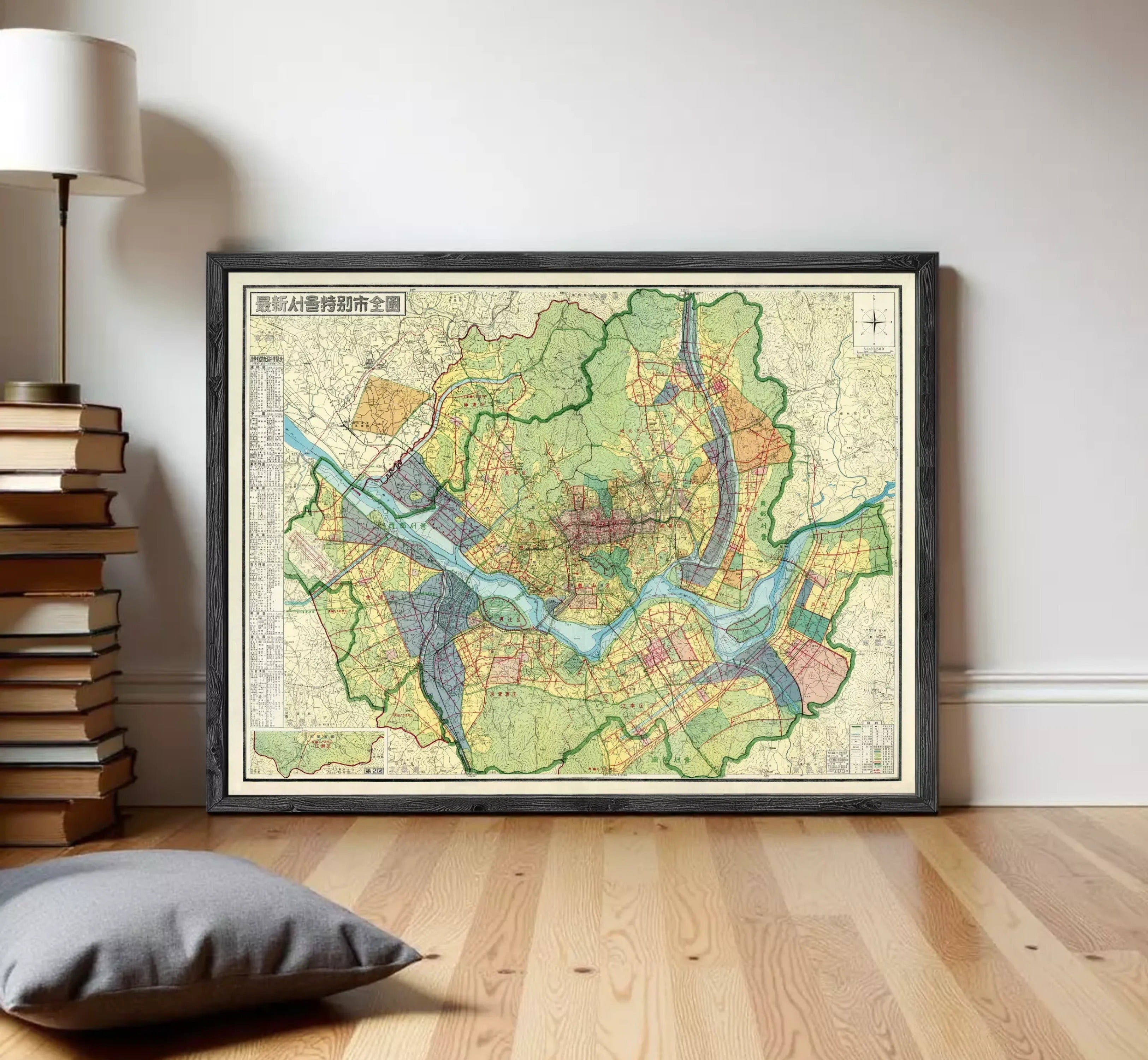 The image is a framed map of a city, showing various streets, landmarks, and geographical features.