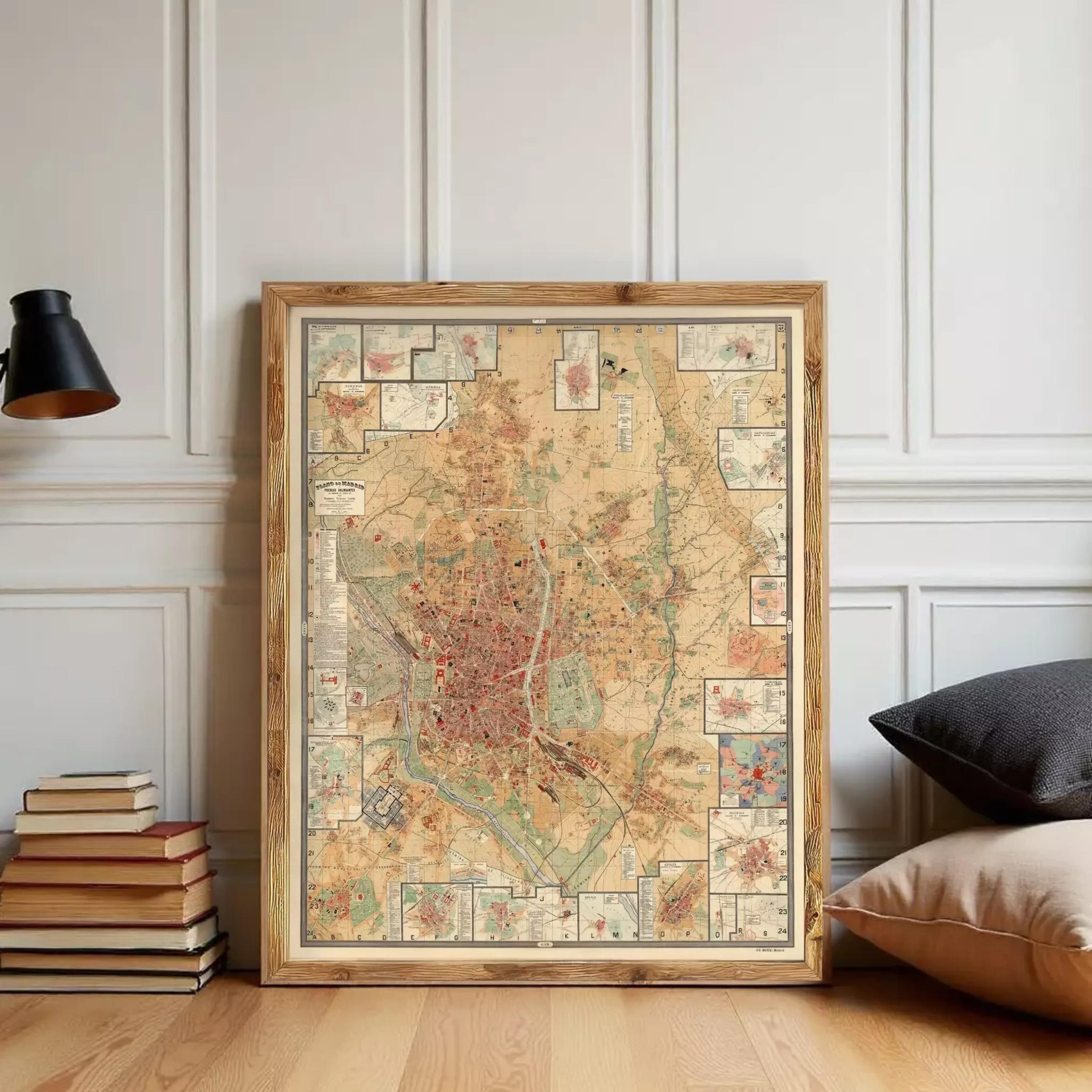 a large framed map of a city, with various landmarks and streets depicted on it. The map is placed on a wooden floor, and there are some books and pillows nearby.