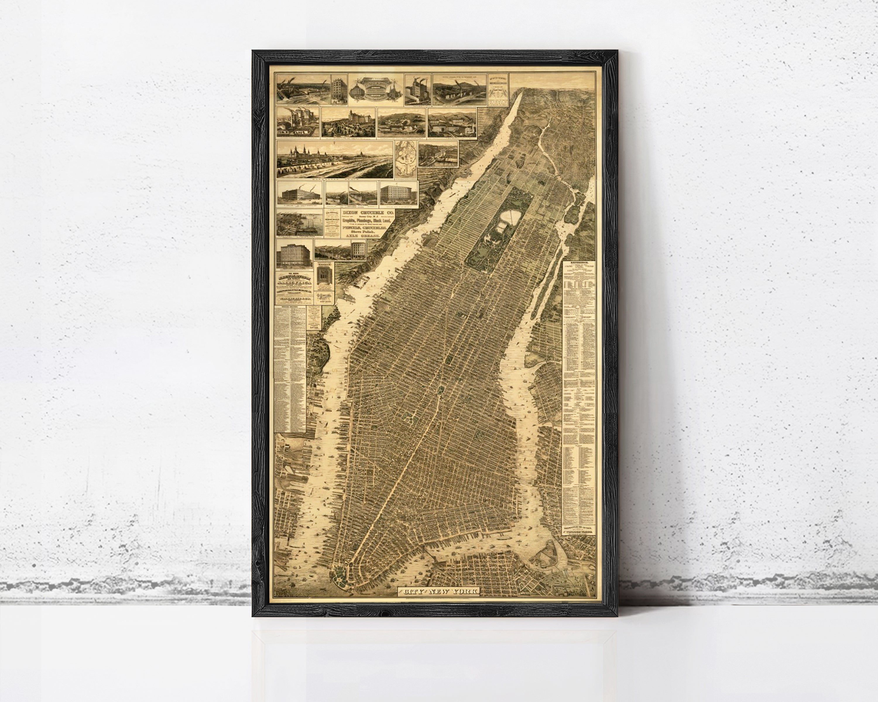 The image is a framed vintage map of New York City, depicting various landmarks and streets in a detailed and intricate manner.