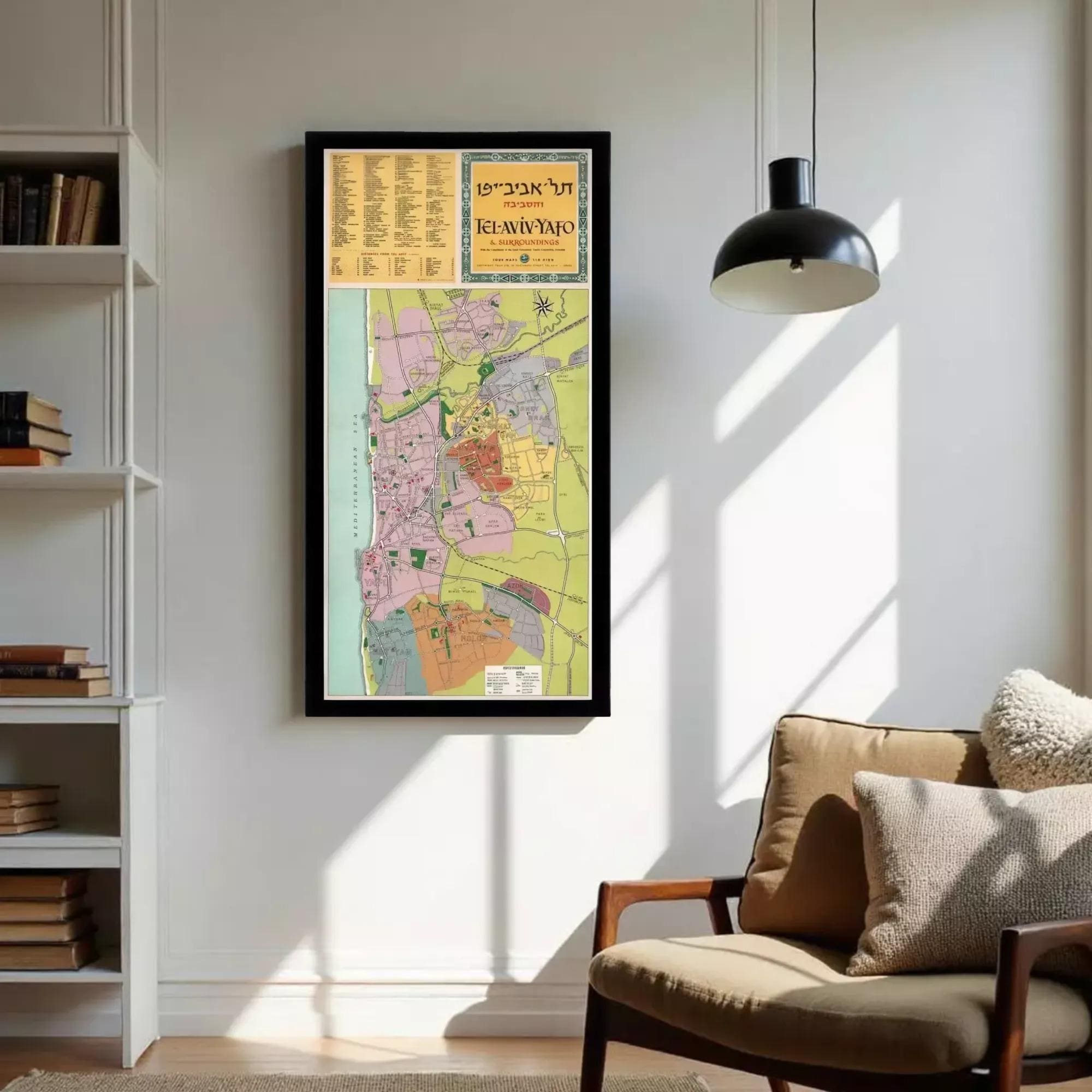 a large framed map of Tel Aviv, Israel, hanging on a white wall in a living room.